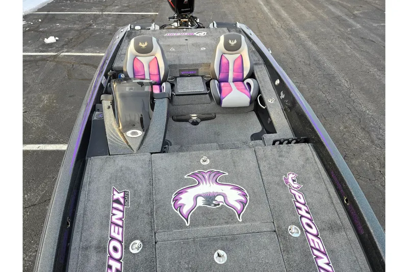 Slide: The Image of 2016 Phoenix 721 ProXP boat interior with custom seats and logo detailing. - 18