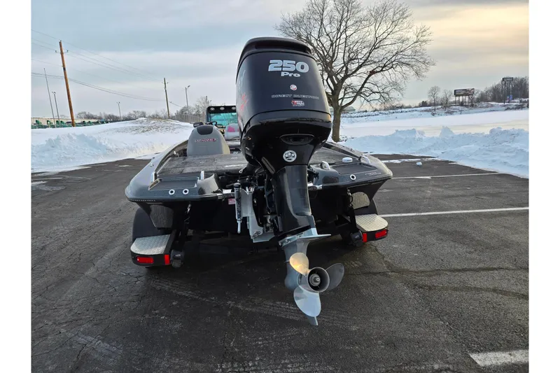 Slide: The Image of 2016 Phoenix 721 ProXP boat with 250 Pro engine in snowy parking lot. - 2