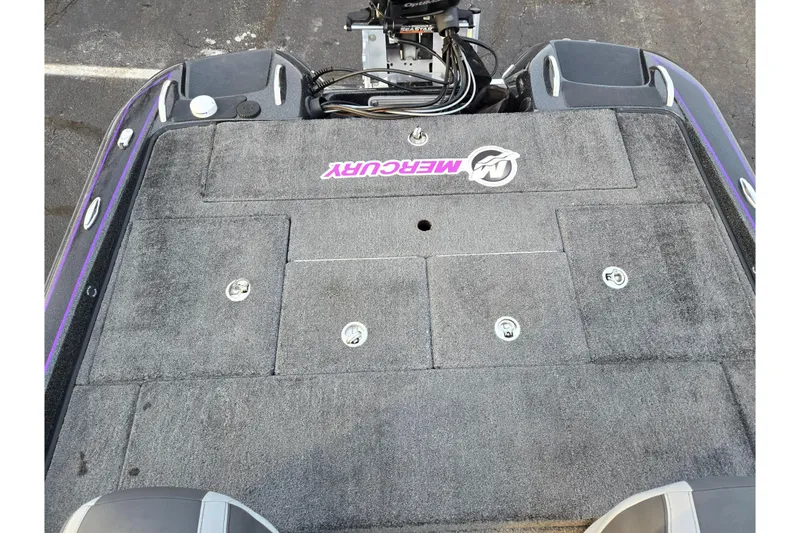 Slide: The Image of 2016 Phoenix 721 ProXP boat deck with Mercury branding, featuring storage compartments. - 21