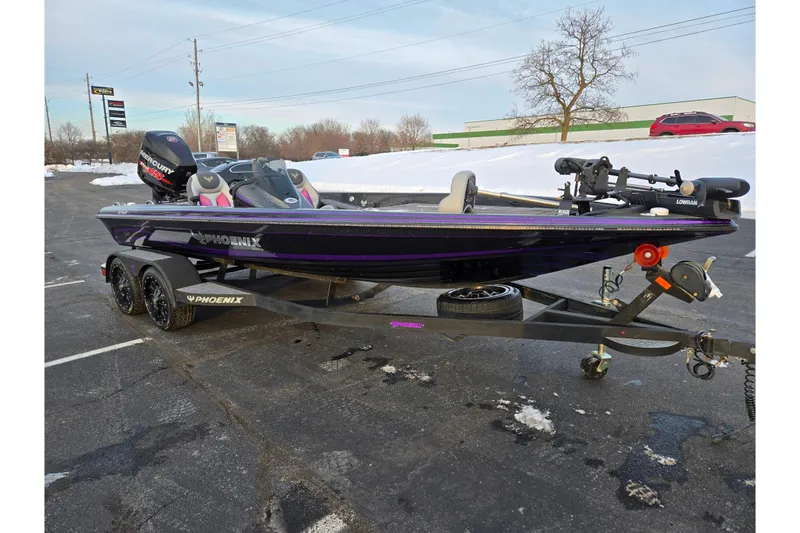 Slide: The Image of 2016 Phoenix 721 ProXP bass boat on trailer in snowy parking lot. - 5