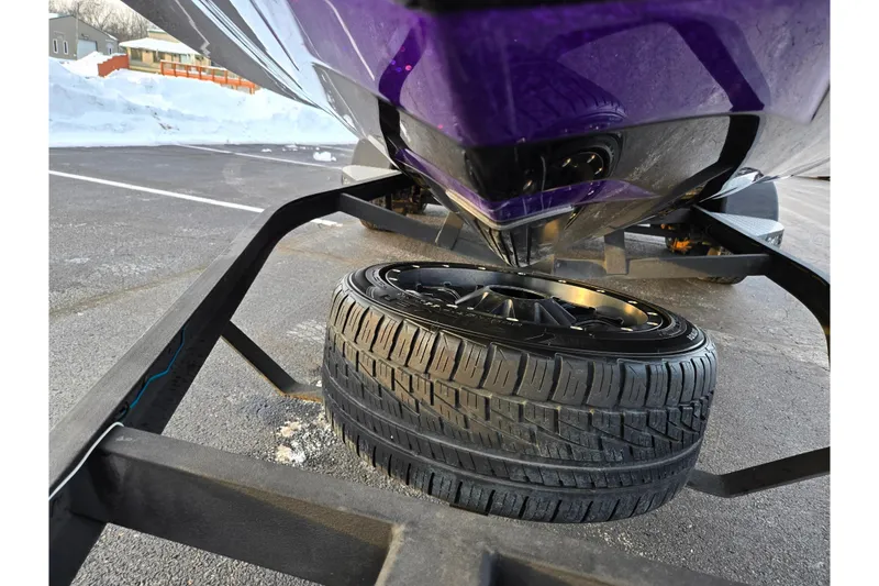 Slide: The Image of 2016 Phoenix 721 ProXP boat on trailer with spare tire, snowy background. - 7