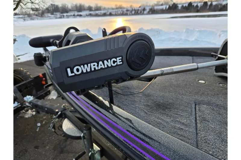 Slide: The Image of 2016 Phoenix 721 ProXP boat with Lowrance equipment, lakeside at sunset. - 9
