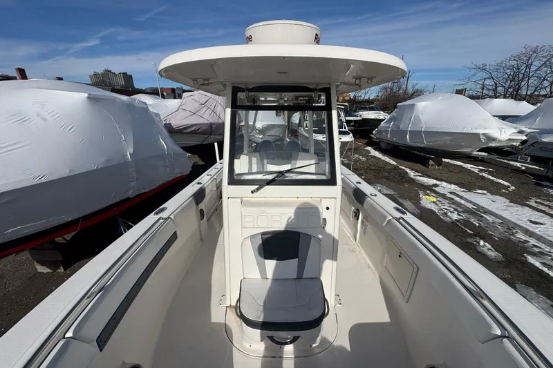 Slide: The Image of 2020 Robalo R272 Center Console boat in winter storage. - 10