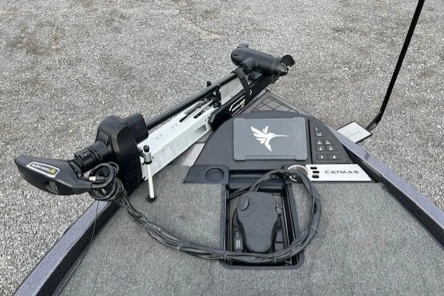 Slide: The Image of 2026 Caymas CX 21 PRO boat deck with trolling motor and control panel. - 6