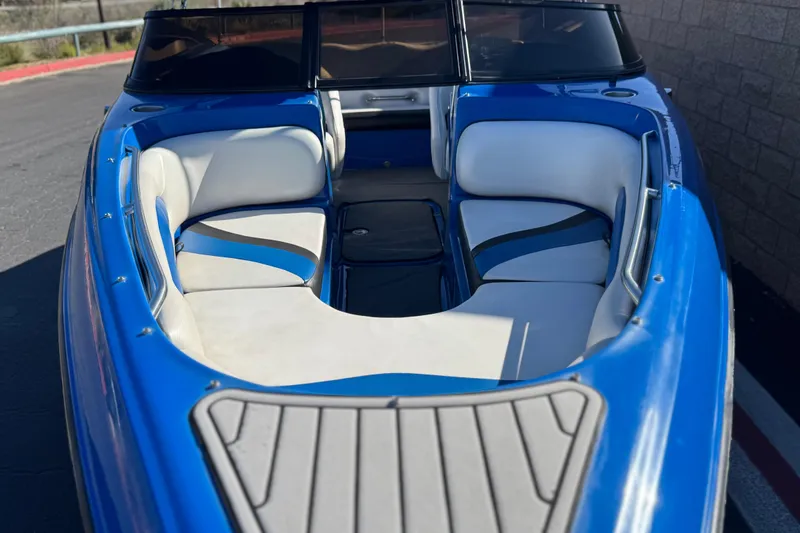 Slide: The Image of Blue 2015 Caravelle 22 Interceptor boat with white interior seating. - 10