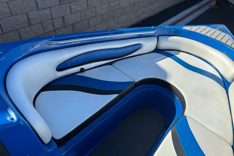 Slide: The Image of 2015 Caravelle 22 Interceptor boat interior with blue and white seating. - 12