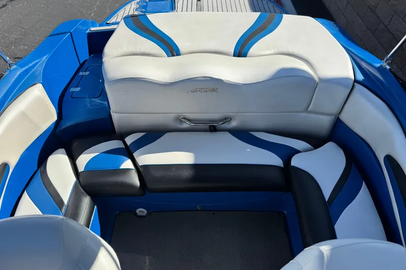 Slide: The Image of 2015 Caravelle 22 Interceptor boat interior with blue and white seating design. - 16