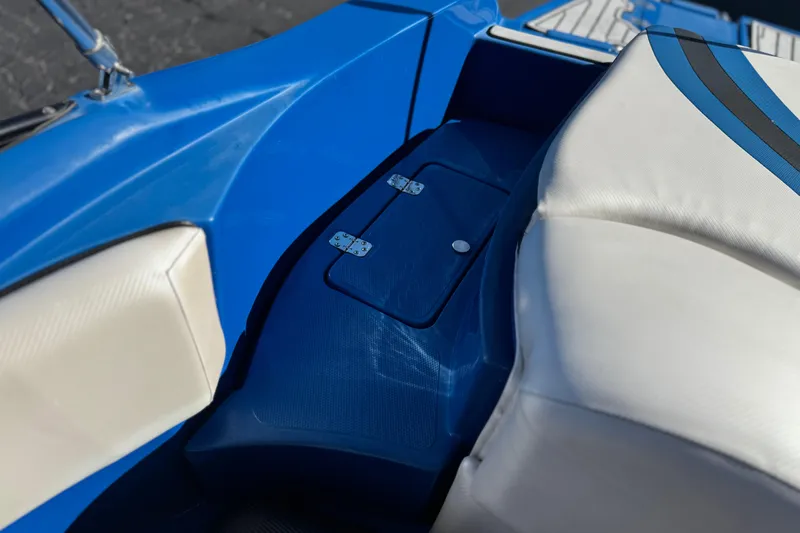 Slide: The Image of Blue and white interior of 2015 Caravelle 22 Interceptor boat, featuring sleek design elements. - 19