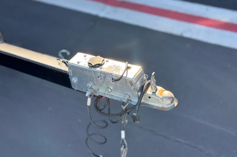 Slide: The Image of Trailer hitch of a 2015 Caravelle 22 Interceptor on asphalt background. - 27