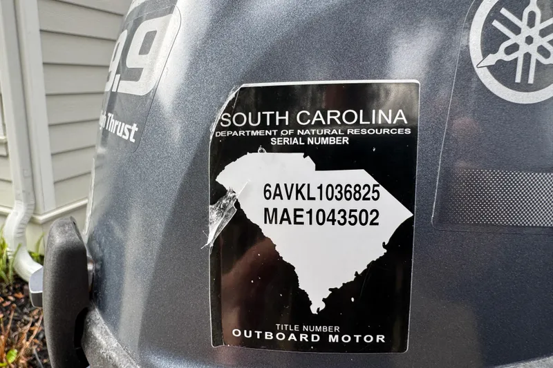Slide: The Image of Sticker on Yamaha outboard motor with South Carolina registration details. North River 21' Seahawk, 2016. - 12