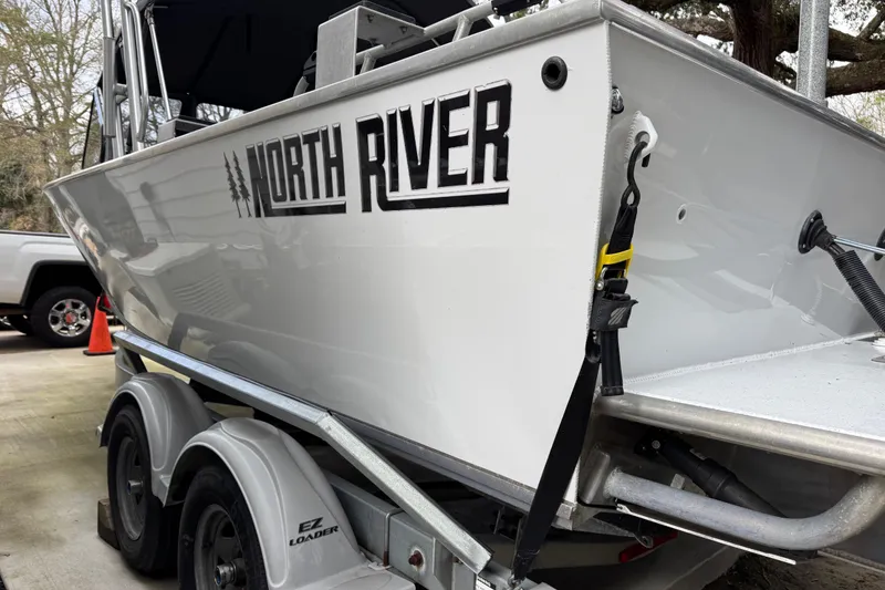 Slide: The Image of 2016 North River 21' Seahawk boat on trailer, side view with logo visible. - 13