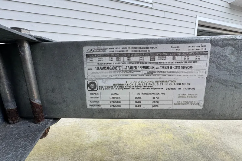 Slide: The Image of Close-up of a 2016 North River 21' Seahawk trailer label with specifications and tire information. - 18