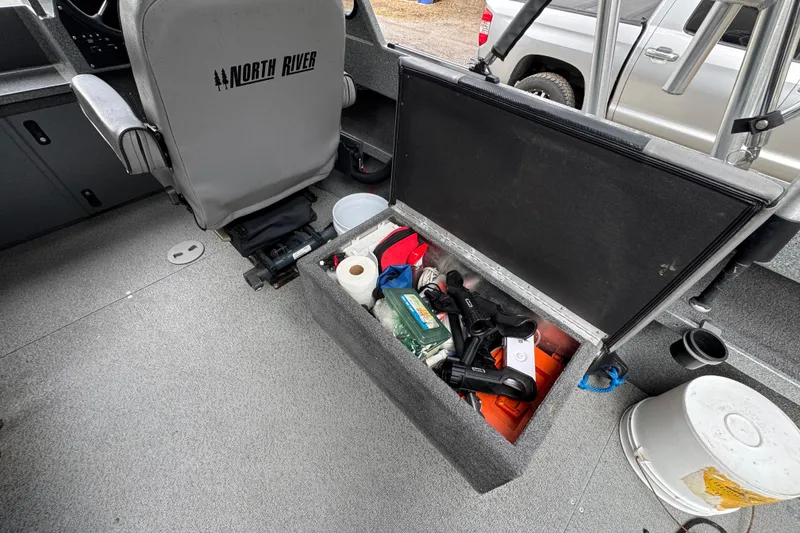 Slide: The Image of Interior of a 2016 North River 21' Seahawk boat with storage compartment open. - 25