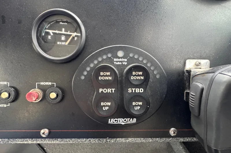 Slide: The Image of Control panel of a 2016 North River 21' Seahawk boat with trim tab controls. - 33