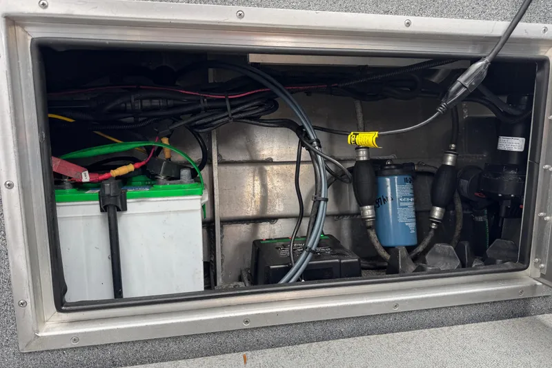 Slide: The Image of Battery compartment of a 2016 North River 21' Seahawk boat, showing wiring and components. - 39