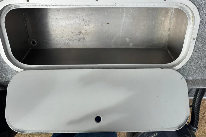 Slide: The Image of Open storage compartment on a 2016 North River 21' Seahawk boat. - 42