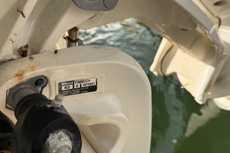 Slide: The Image of Yamaha F300UCA engine on 2021 Robalo R317 Dual Console boat, close-up view. - 15