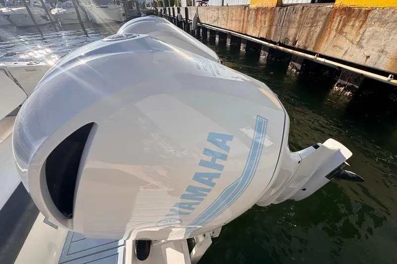 Slide: The Image of 2021 Robalo R317 Dual Console with Yamaha outboard engine at dockside. - 17