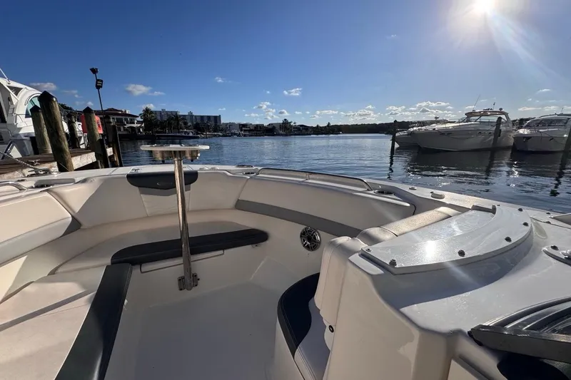 Slide: The Image of 2021 Robalo R317 Dual Console boat docked under sunny skies. - 42