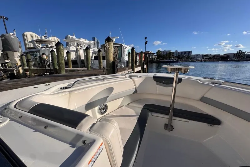 Slide: The Image of 2021 Robalo R317 Dual Console boat docked at marina under clear blue sky. - 43