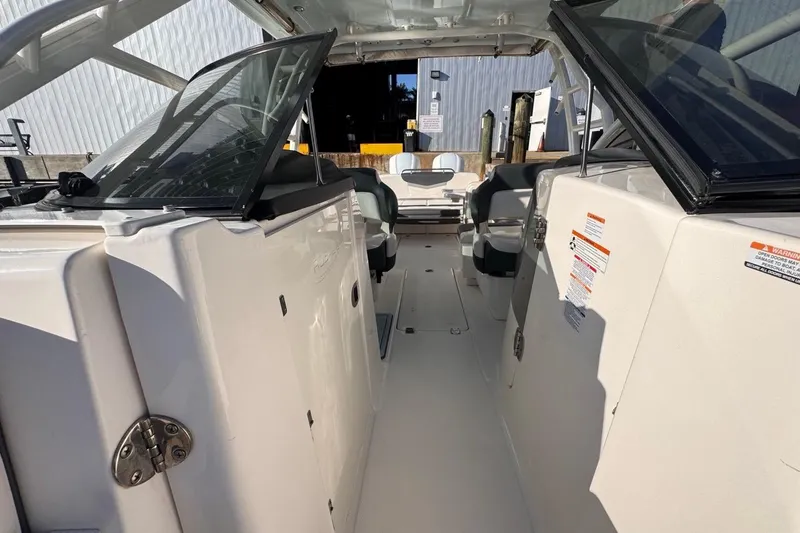 Slide: The Image of 2021 Robalo R317 Dual Console boat interior with open cockpit and seating. - 53