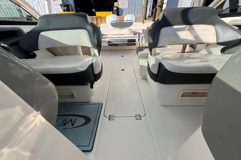 Slide: The Image of 2021 Robalo R317 Dual Console boat interior with comfortable seating and spacious layout. - 54