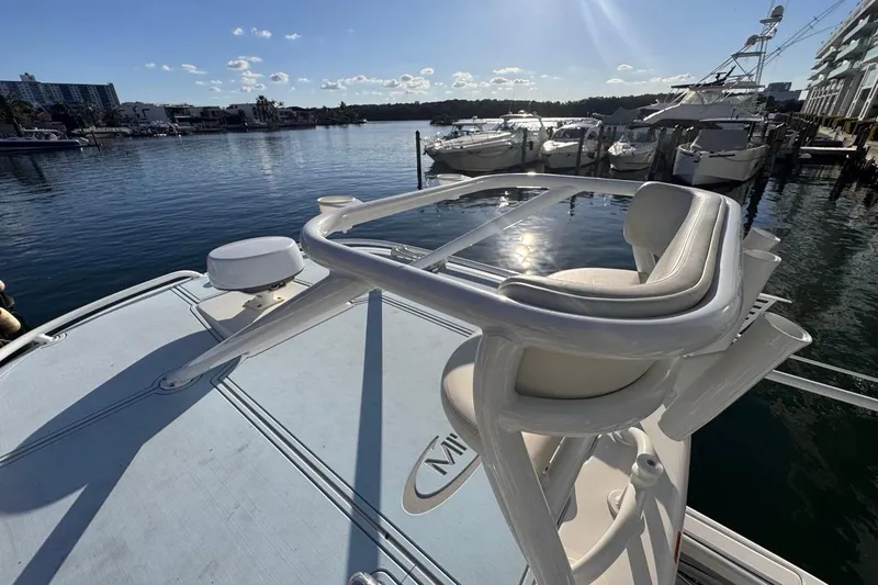 Slide: The Image of 2021 Robalo R317 Dual Console boat docked in a sunny marina. - 60