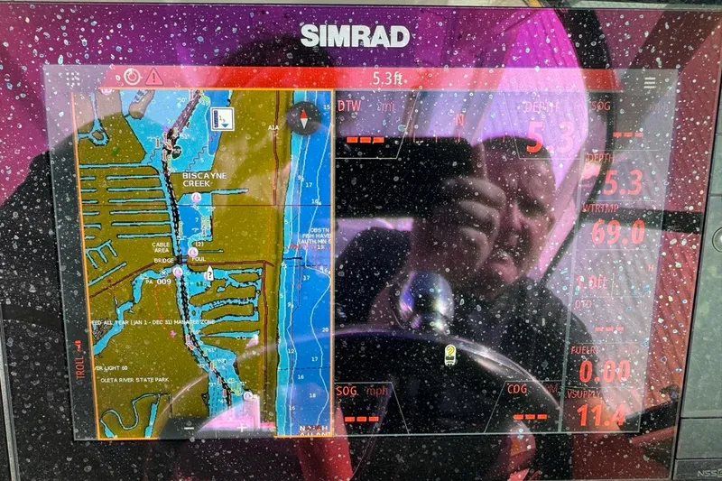 Slide: The Image of Simrad navigation display on 2021 Robalo R317 Dual Console, showing Biscayne Creek map. - 69