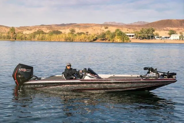 The Image of 2024 Caymas CX 20 boat on a tranquil lake. - 1