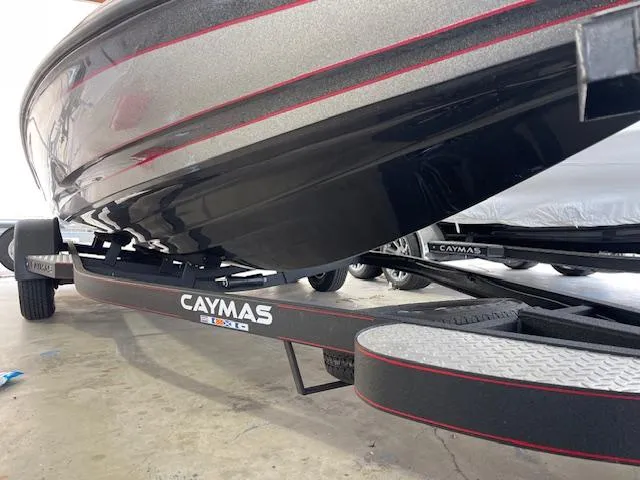 Slide: The Image of 2024 Caymas CX 20 boat on trailer in a garage. - 14