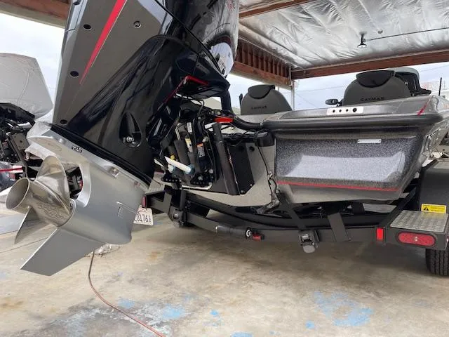 Slide: The Image of 2024 Caymas CX 20 boat hull and motor in a garage. - 4