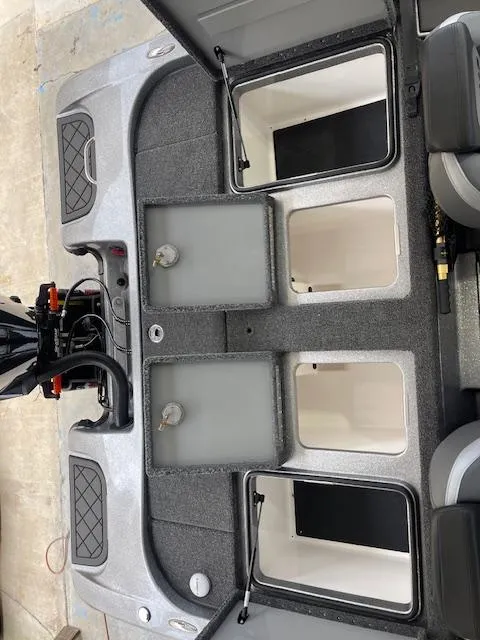 Slide: The Image of 2024 Caymas CX 20 boat interior storage compartments. - 7