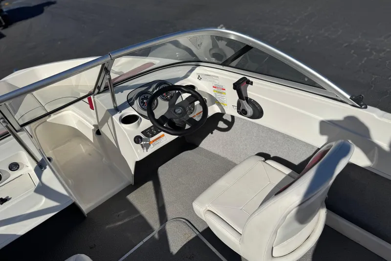 Slide: The Image of 2015 Bayliner 175 Bowrider interior with steering wheel and seating. - 20