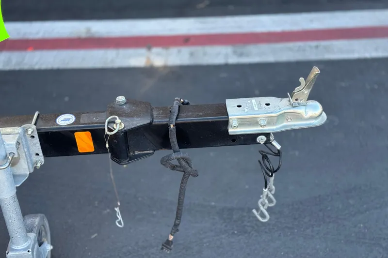 Slide: The Image of Trailer hitch of a 2015 Bayliner 175 Bowrider on asphalt background. - 24