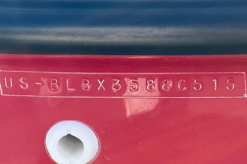 Slide: The Image of 2015 Bayliner 175 Bowrider hull identification number on red surface. - 26