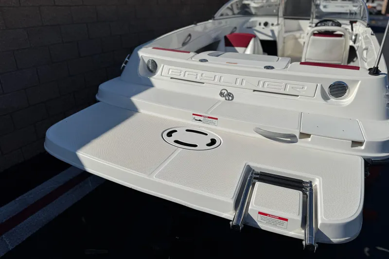 Slide: The Image of 2015 Bayliner 175 Bowrider boat with swim platform and ladder, showcasing sleek design. - 6