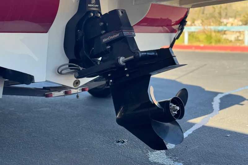 Slide: The Image of 2015 Bayliner 175 Bowrider with MerCruiser Alpha One outdrive, parked on pavement. - 7