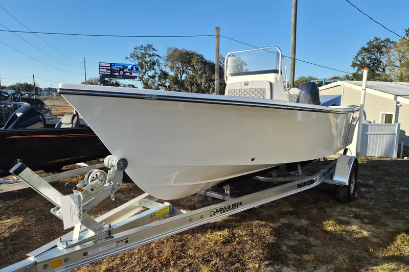 The Image of 2026 May-Craft 192 boat on trailer, displayed outdoors under clear blue sky. - 1