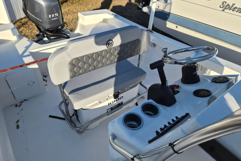 Slide: The Image of 2026 May-Craft 192 boat interior with steering wheel, seating, and Yamaha 115 outboard motor. - 4