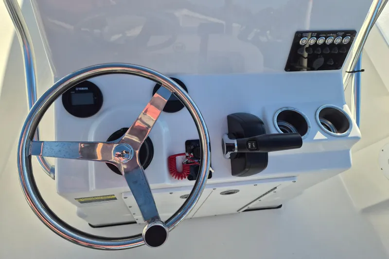 Slide: The Image of Steering console of 2026 May-Craft 192 boat with controls and gauges. - 7