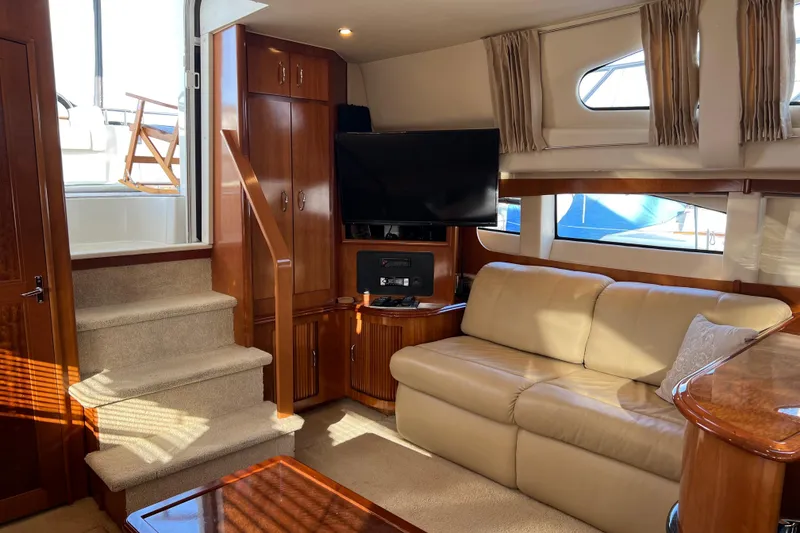 Slide: The Image of Luxurious interior of 2006 Carver 39 Motor Yacht with plush seating and entertainment area. - 10