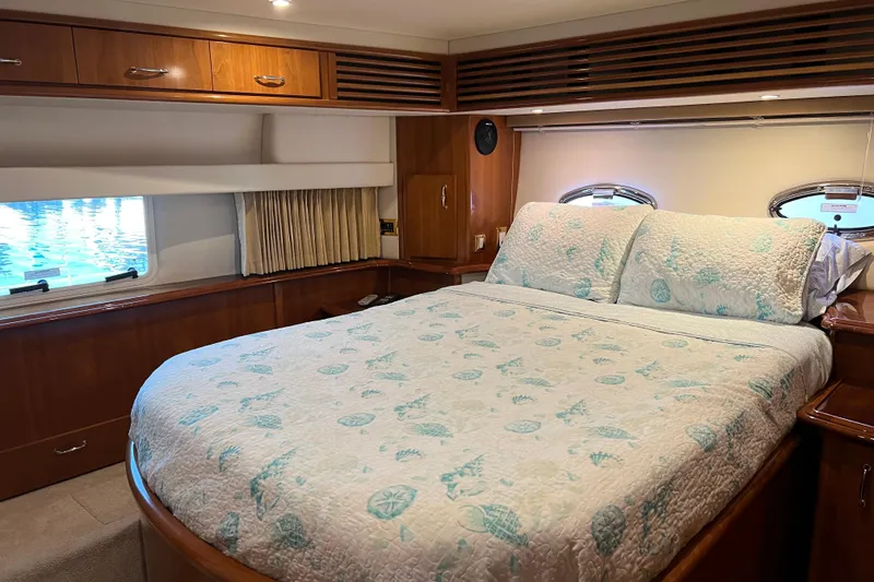 Slide: The Image of Luxurious bedroom interior of 2006 Carver 39 Motor Yacht with elegant bedding. - 14