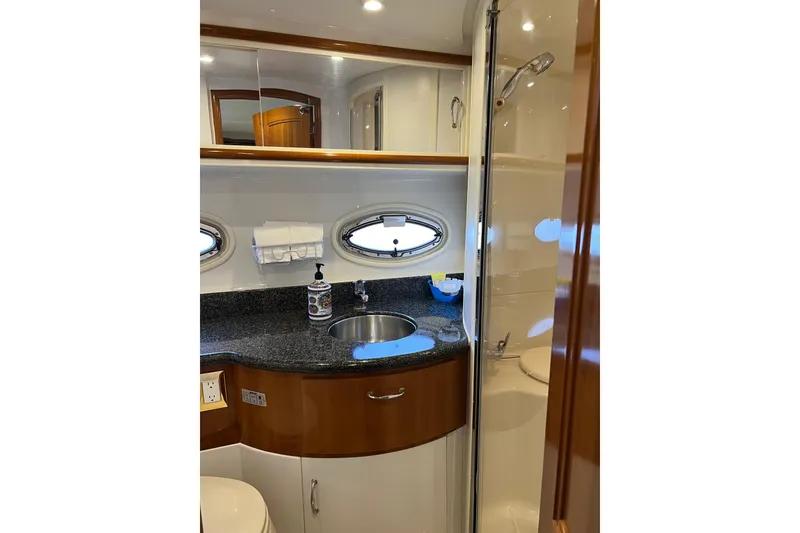 Slide: The Image of 2006 Carver 39 Motor Yacht bathroom with sink, mirror, and shower. - 17