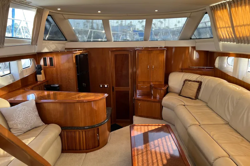 Slide: The Image of Luxurious interior of 2006 Carver 39 Motor Yacht with elegant wood finishes and plush seating. - 9