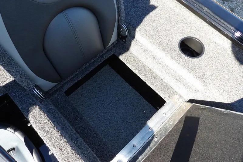 Slide: The Image of 2026 Lund 1875 Renegade boat interior with storage compartment and seating detail. - 17