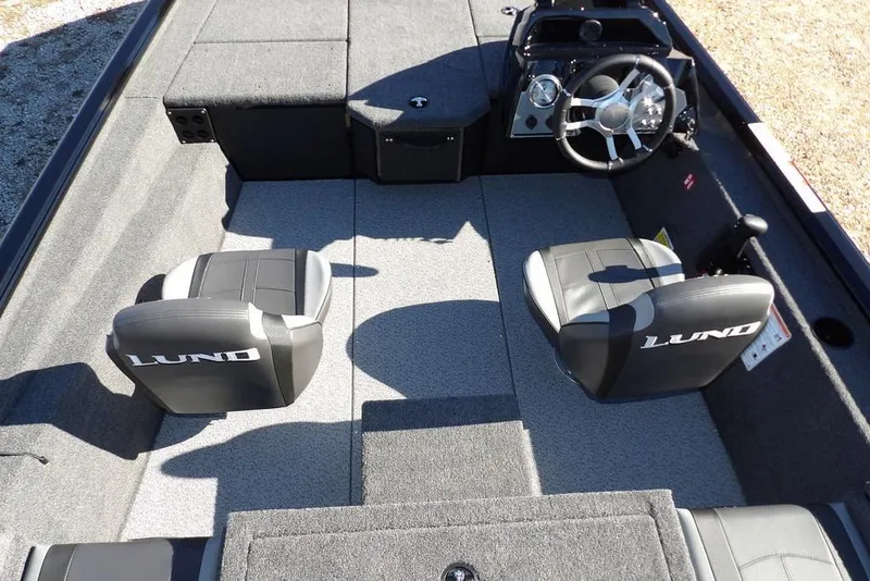 Slide: The Image of 2026 Lund 1875 Renegade boat interior with dual seats and steering console. - 20