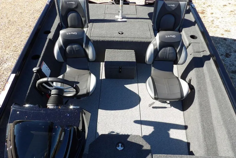 Slide: The Image of 2026 Lund 1875 Renegade boat interior with dual seats and steering console. - 22