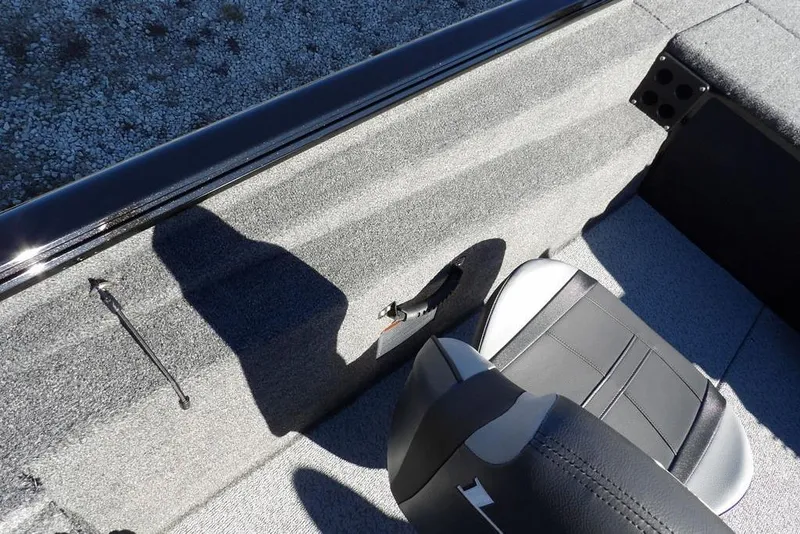 Slide: The Image of 2026 Lund 1875 Renegade boat interior with gray seating and textured flooring. - 24