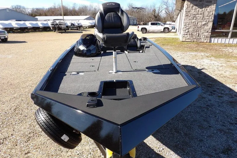 Slide: The Image of 2026 Lund 1875 Renegade fishing boat, spacious deck, parked outdoors. - 3