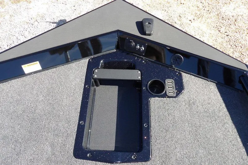 Slide: The Image of 2026 Lund 1875 Renegade boat deck with storage compartment and control panel. - 33